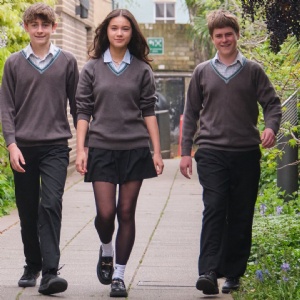 Three Senior School students walking on campus